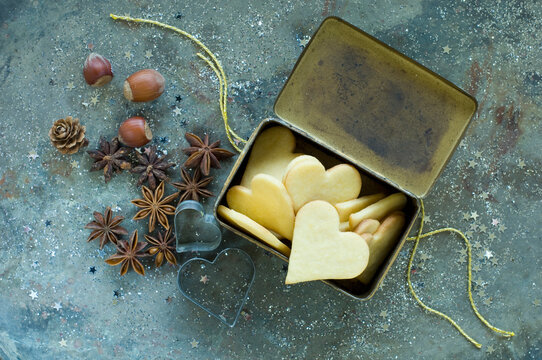 Heart-shaped Christmas cookies in an old tin can