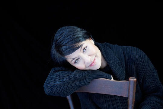 Portrait of smiling woman on chair