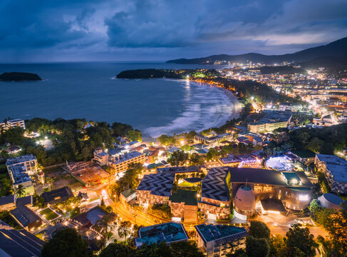Aerial night view of the city and seaside at Kata Beach, Phuket, Thailand