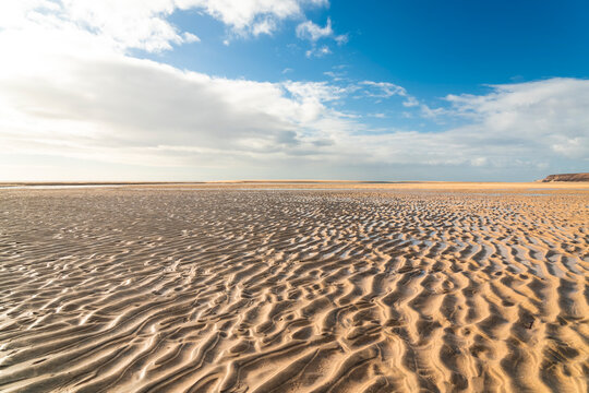 Low tide reveals sand ripples at Jandia beach in Fuerteventura