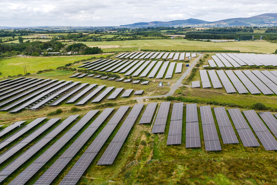 Aerial view of a solar park in green fields of Ireland