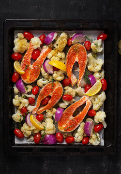 Fresh Salmon with Vegetables Ready for Oven Cooking. Top view, vertical