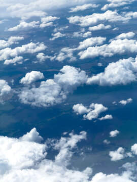 High-altitude view of clouds from airplane window