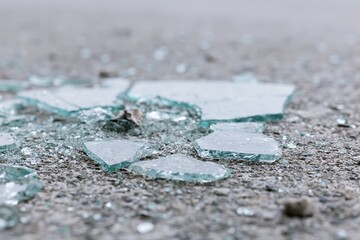 Obraz premium The Broken Glass Shards on the Street Create a Quiet Hazard and Texture