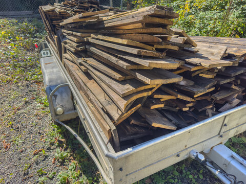 Trailer with Old Wooden Planks for Recycling