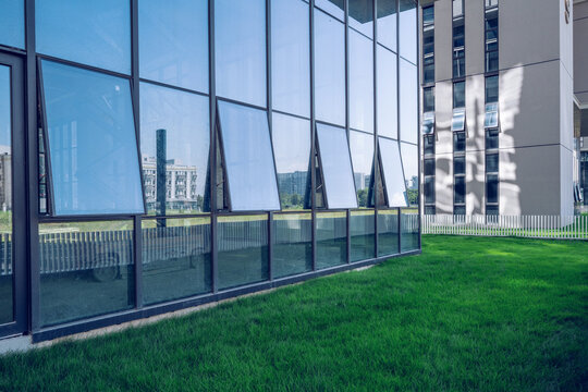 Blue glass curtain wall of an office building in the Cuiheng New Area industrial park, Zhongshan City, China.