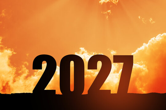 Silhouette 2027 with sunset sky and number like 2027 abstract background. Concept of start with strategy, win, plan, goal and objective target.
