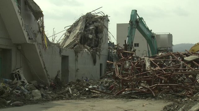 Construction Equipment Clearing Rubble In Aftermath Of Tsunami In Japan