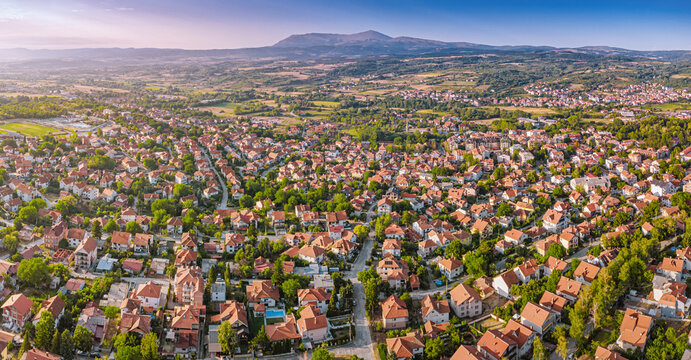 Sokobanja resort town with terracotta rooftops and Rtanj mountain backdrop - travel, real estate and regional development in Balkans concept