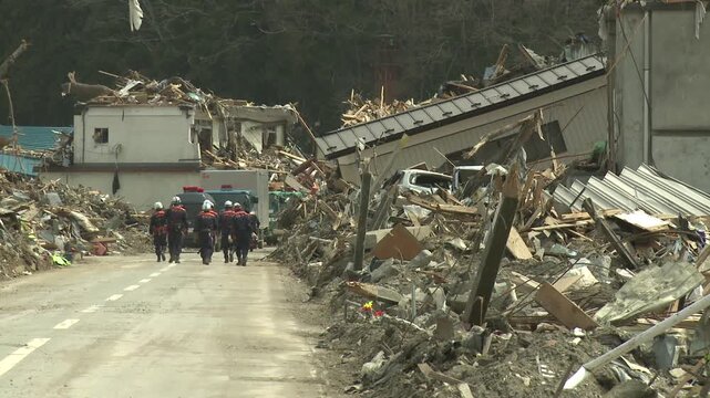Rescue Workers In Disaster Zone In Aftermath Of Tsunami In Japan