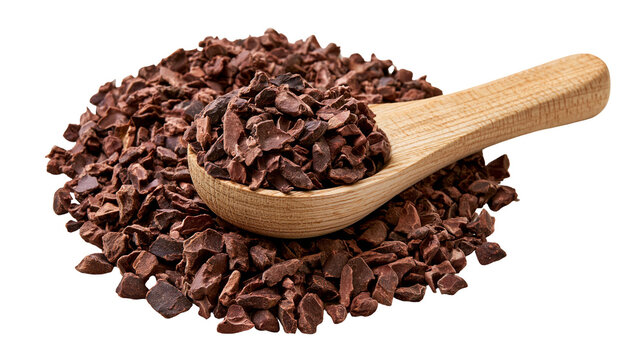 Raw organic cacao nibs in a wooden spoon on a pile of crushed cocoa beans