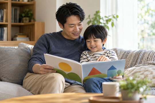 Father Reading a Book to His Son
