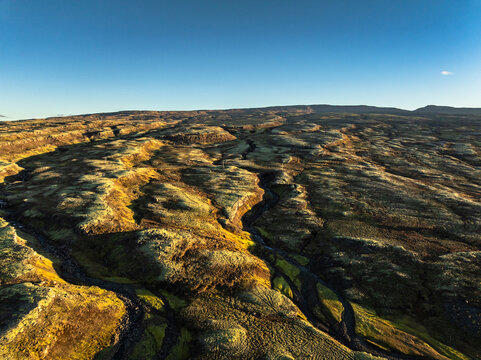 Aerial view of the scenery over a mountain range - Iceland
