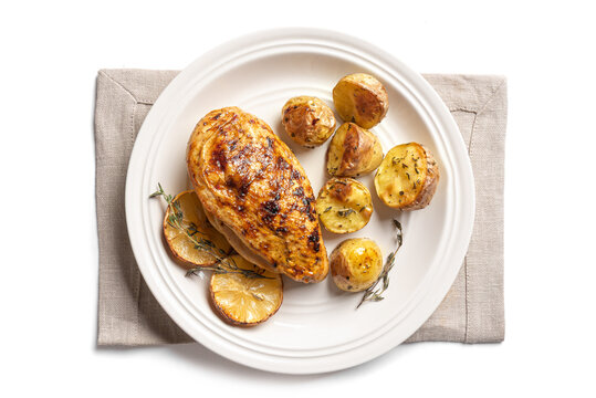Oven roasted lemon garlic chicken and potatoes on plate