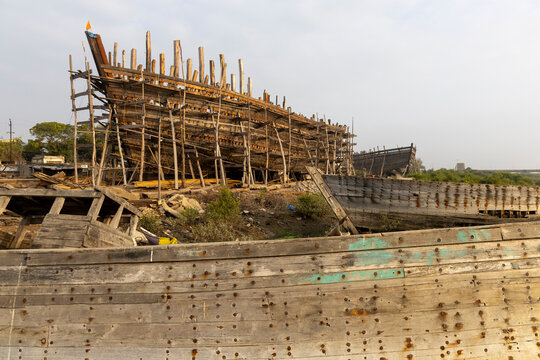 Dhow shipyard with hulls under construction, Mandvi, India