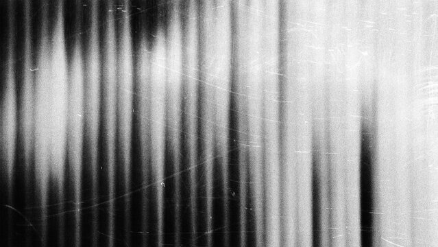 Black and white vertical striped abstract background with soft gradient lighting and vignette effect, perfect for modern design, digital art, presentations, and creative graphic projects