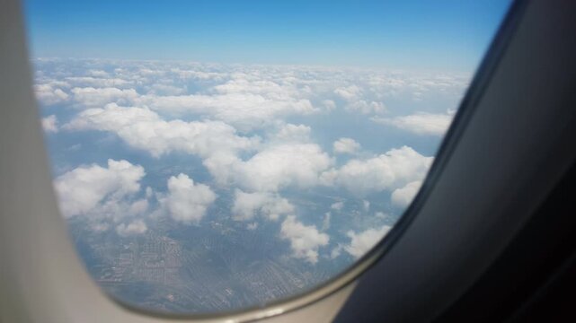 Airplane engine and sky seen from passenger window