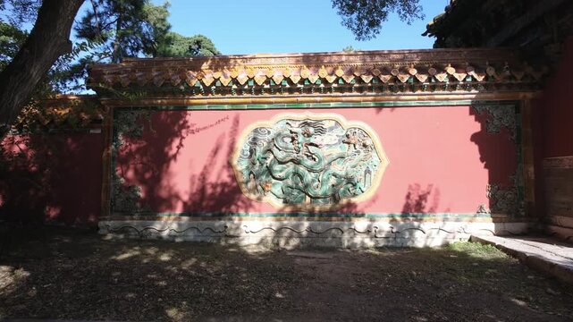 Dragon relief on red wall at Zhaoling Tomb in Shenyang, China