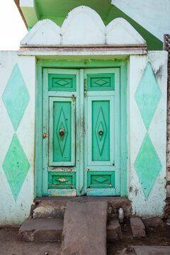 Weathered mint green door, Mandvi, India