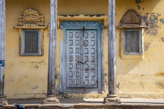 Carved door between lattice windows, Mandvi, India