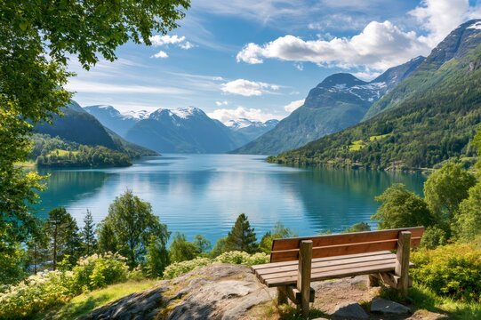 Wooden bench overlooking tranquil fjord landscape in norway