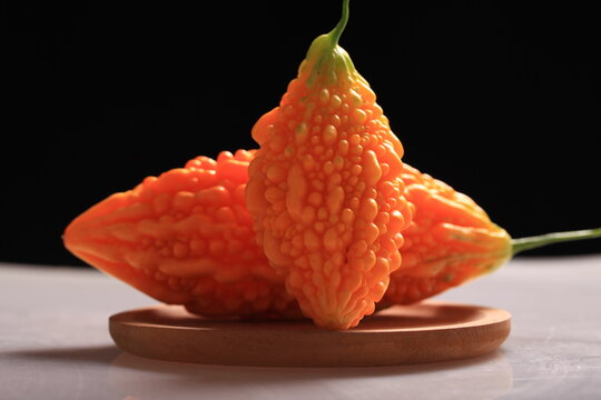 Fresh bitter gourd, black background