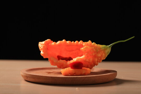 Fresh bitter gourd, black background