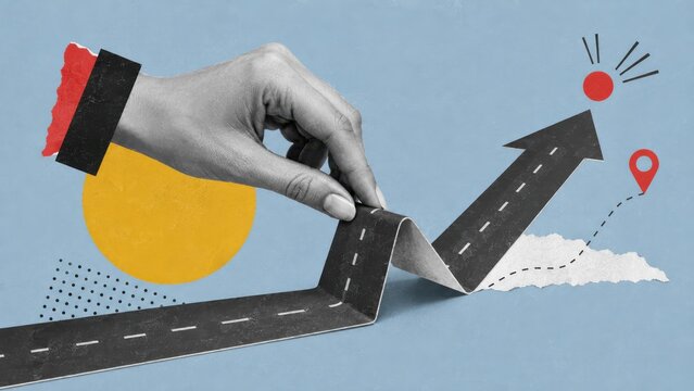 Hand folding a paper road so it turns upward into an arrow. Changing course, redirecting strategy and steering a business toward its goal