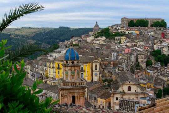 Panoramic view of the historic hillside town of Ragusa Ibla in Sicily under a cloudy sky