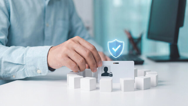 Identity access management and employee ID protection concept, man placing ID badge with padlock inside white cube ring and shield checkmark for cybersecurity, privacy and verification