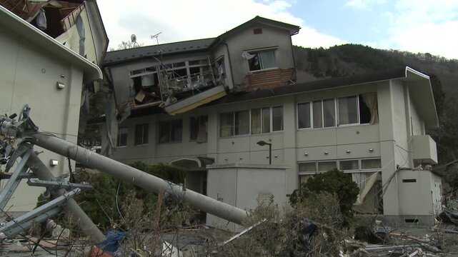 House Lies Precariously On Building In Aftermath Of Tsunami In Japan
