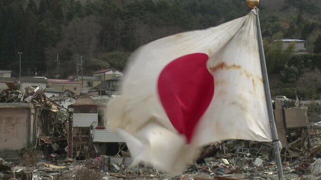 Japanese Flag Flies In Disaster Zone In Aftermath Of Tsunami In Japan