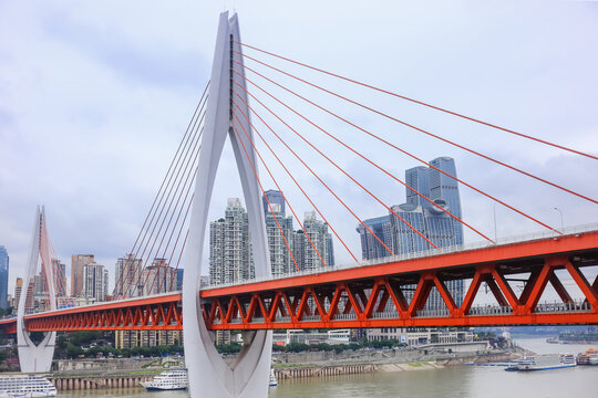 Dongshuimen Yangtze River Bridge in Chongqing, China, Modern orange steel truss bridge across Yangtze River in Chongqing, China, The iconic Dongshuimen Bridge with Chongqing city skyline in background