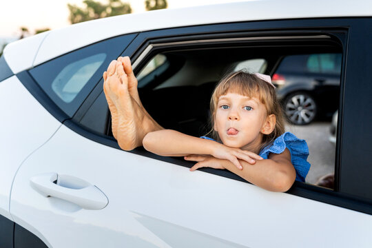 Child having fun traveling by car with mother, enjoying playful road trip vacation
