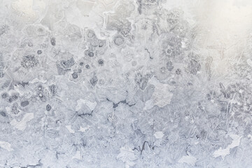 Fototapeta premium ice pattern on winter glass, abstract background on a cold sunny day