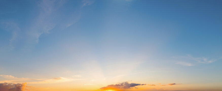 Golden sunbeams pierce through soft clouds
