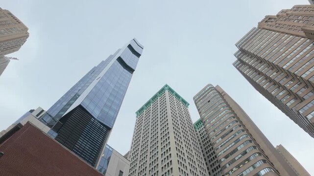 Financial district skyscrapers and impressive modern buildings towering in new york city, symbol of economy and successful market stock investment on wall street