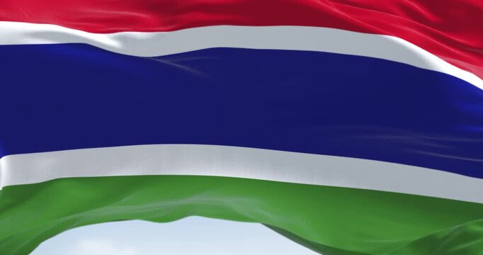 National flag of the Gambia waving in the wind on a clear day