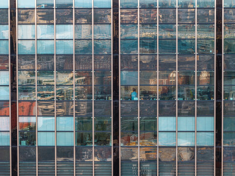 Aerial view of the glass facade of the Berlin Treptowers office building, showing geometric window patterns and reflections of the surrounding urban environment in Berlin, Berlin, Germany.