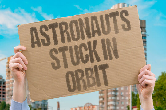 "Astronauts stuck in orbit" Test flight problems extend station stay. ASTRONAUTS. CAPSULE. ORBIT. THRUSTERS. DELAY.