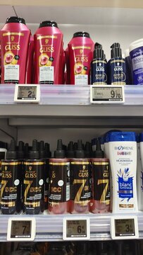 Royan, France - July 25, 2026: E.Leclerc ROYAN CEDEX. Hair care products displayed on a retail shelf including Gliss shampoo and conditioner bottles in various sizes and colors