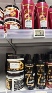 Royan, France - July 25, 2026: E.Leclerc ROYAN CEDEX. Hair care products displayed on a retail shelf, including Schwarzkopf Gliss brand conditioners and treatments in various containers