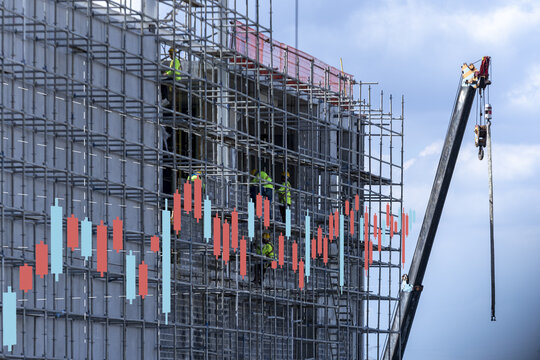 Construction scaffolding building worker crane stock chart financial growth development Construction scaffolding with workers and crane overlaid with stock chart pattern symbolizes financial