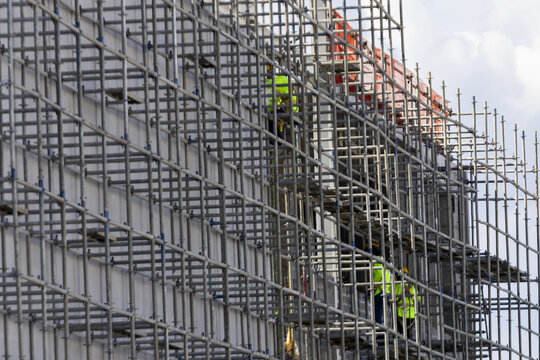 Scaffolding construction worker metal safety building structure industrial framework urban Scaffolding construction worker metal safety building structure industrial framework urban exterior
