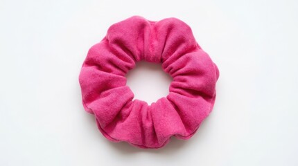 Fototapeta premium Bright pink fabric hair scrunchie for styling hair isolated on a white background