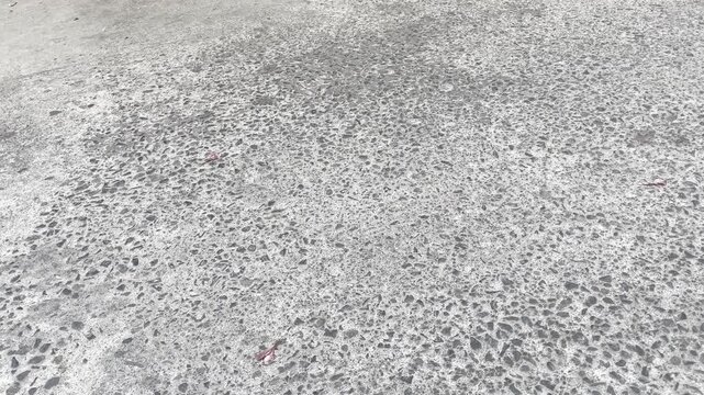 Rough concrete road surface texture close up background