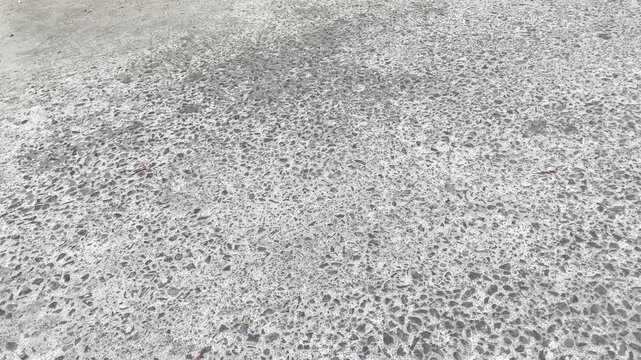 Rough concrete road surface texture close up background
