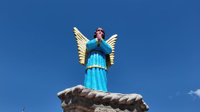 Blue angel statue praying at Simala Shrine in Cebu