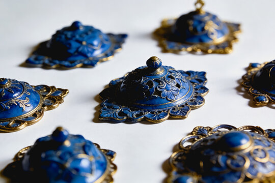 Ornate Blue and Gold Decorative Lids on White Background