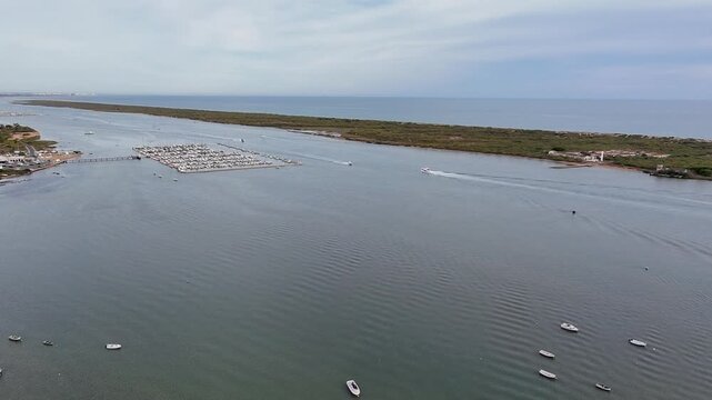 Drone Panoramic of Piedras River, La Flecha de El Rompido and Atlantic Ocean in Huelva, Spain: Sunny Coast, Golden Sand and Peaceful Nature Landscape in Andalusia